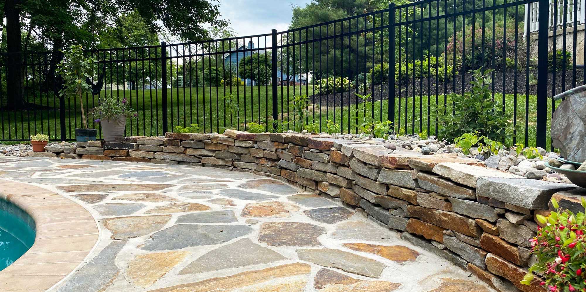 Stone stairway leading through landscaped yard
